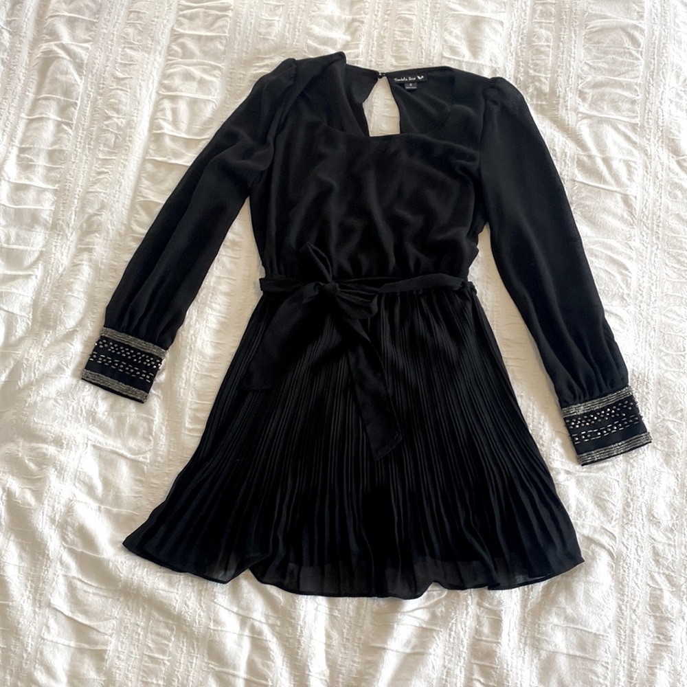 Black semi-formal pleated dress with sheer sleeves and beaded details